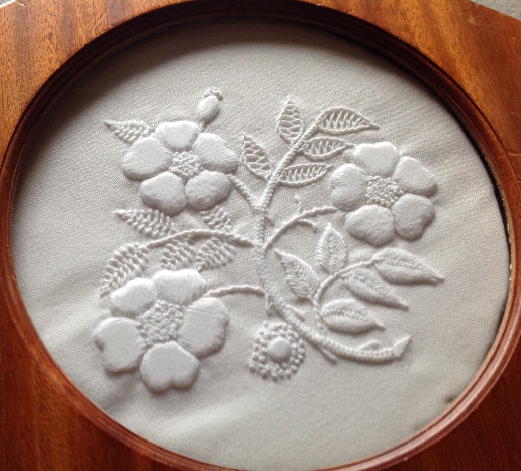 Mountmellick embroidery potstand, with design of flowers